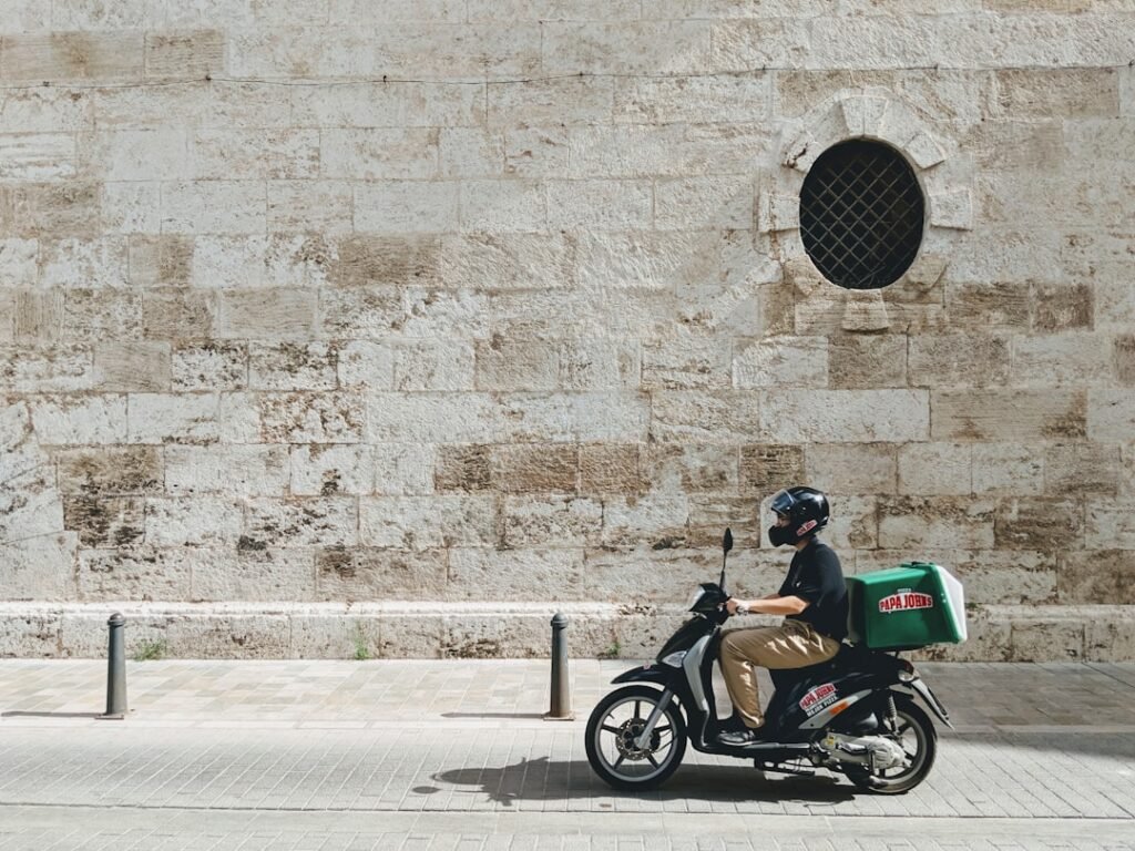 Gig economy delivery driver on the road tracking business miles