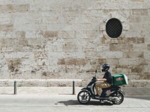 Gig economy delivery driver on the road tracking business miles