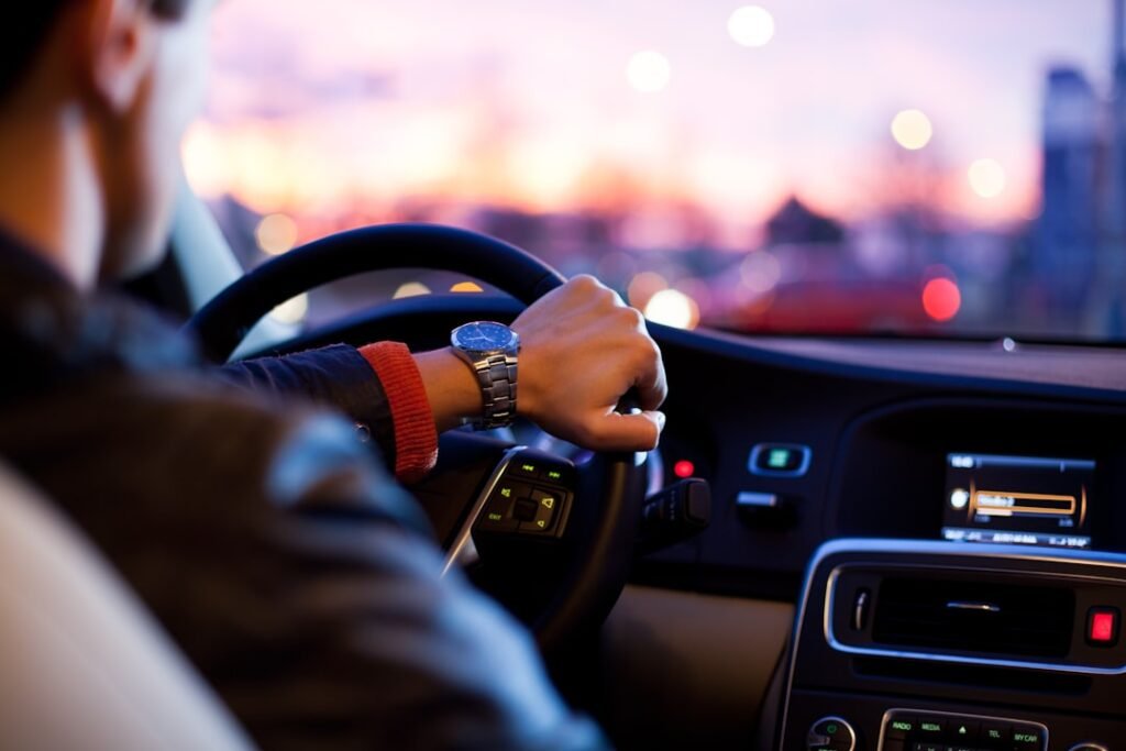 Person driving a car for work — tracking business miles for tax deductions
